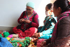 Luna-Leena 2x bloemtulp Hollands rood - zachte wol - handgehaakt in Nepal