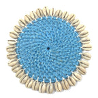 Rotan onderzetter met kauri schelpen