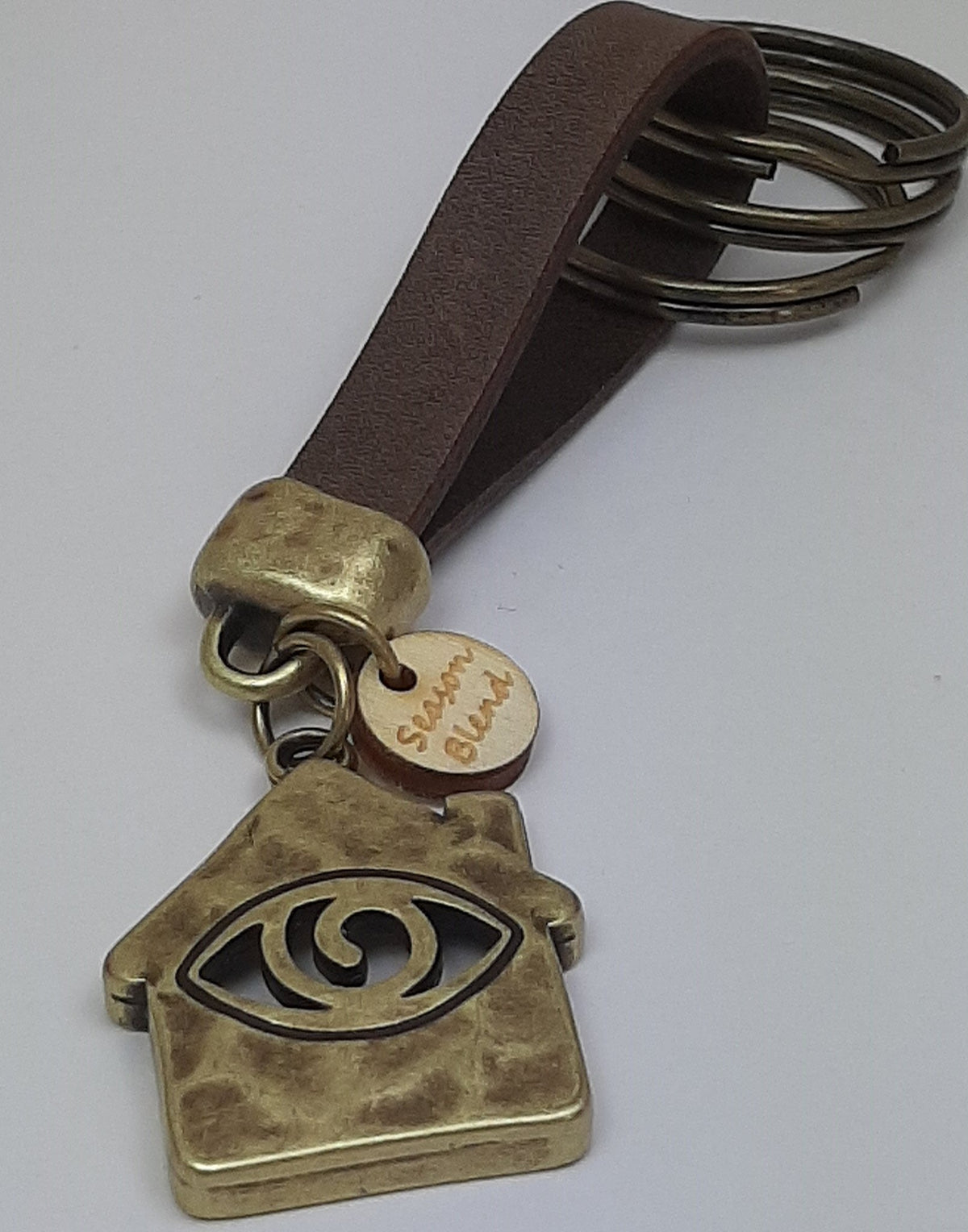 Sleutelhanger van leer Happy Home met Eye brons