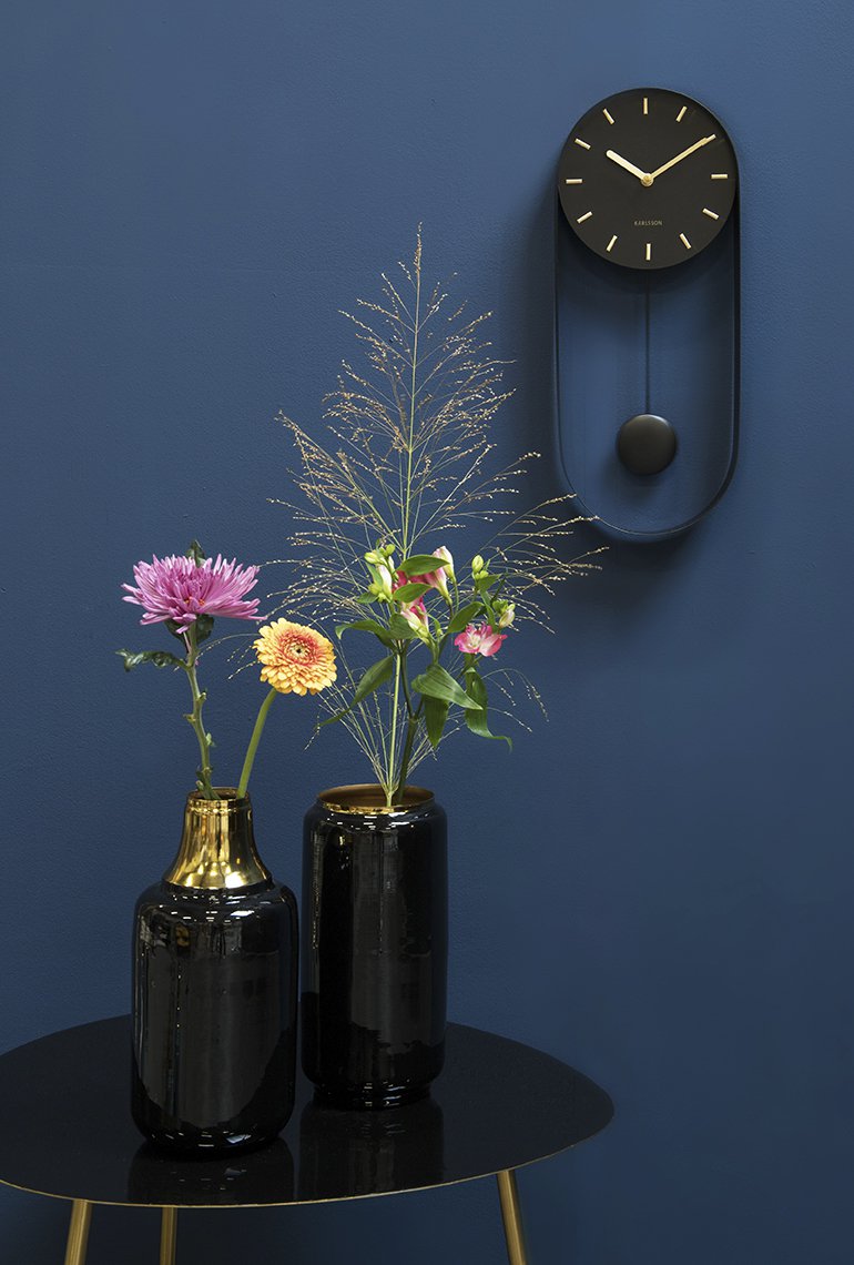 Wandklok slinger charme