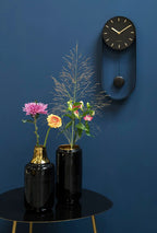 Wandklok slinger charme