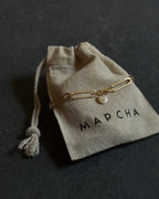 Schakelarmband met gouden munt