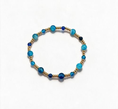 Dames armband Bandagaat 4 en 6 mm met RVS goudkleurige kralen