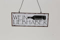 Metalen hanger wijnliefhebber 4st 15x6cm zwart