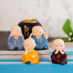 Set van Boeddhabeelden van vier wijze monniken – hars – set van 4