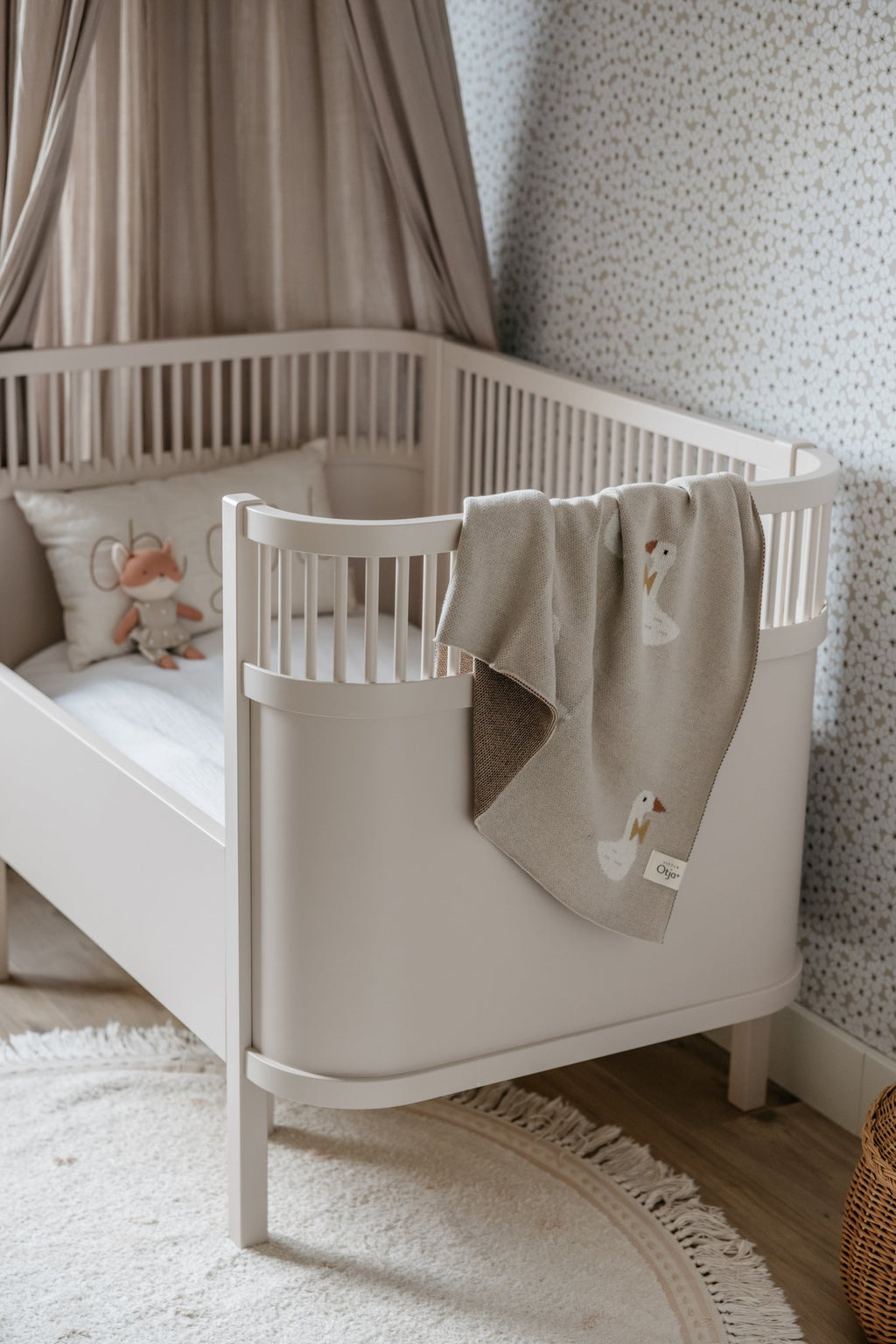 Gebreide katoenen babydeken, beige ganzen