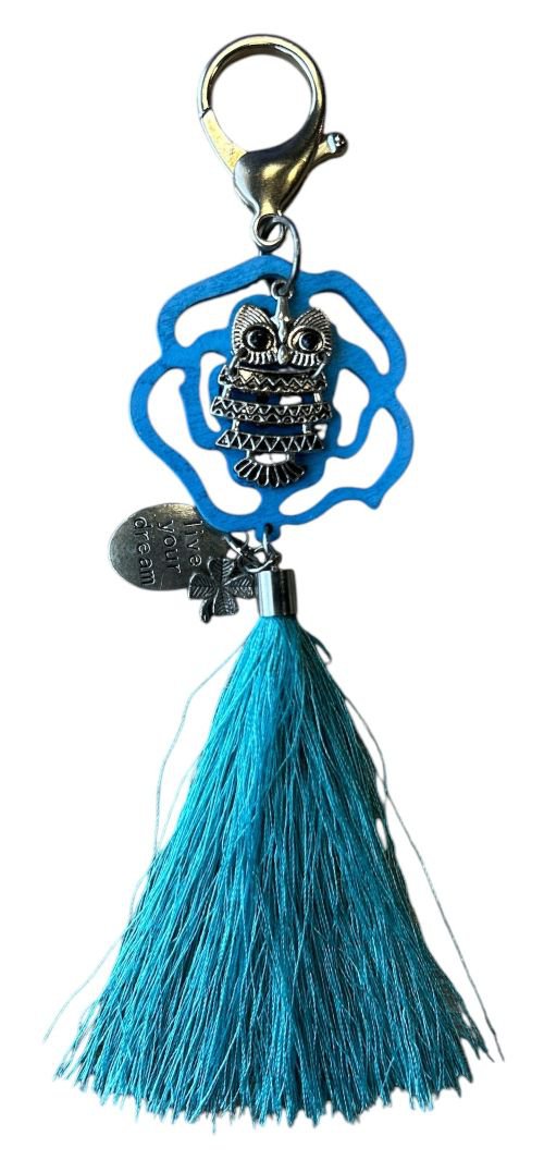 Uil met licht blauwe kwast