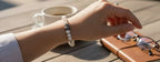 Dames armband Parelmoer 6 mm met Boeddha kraal