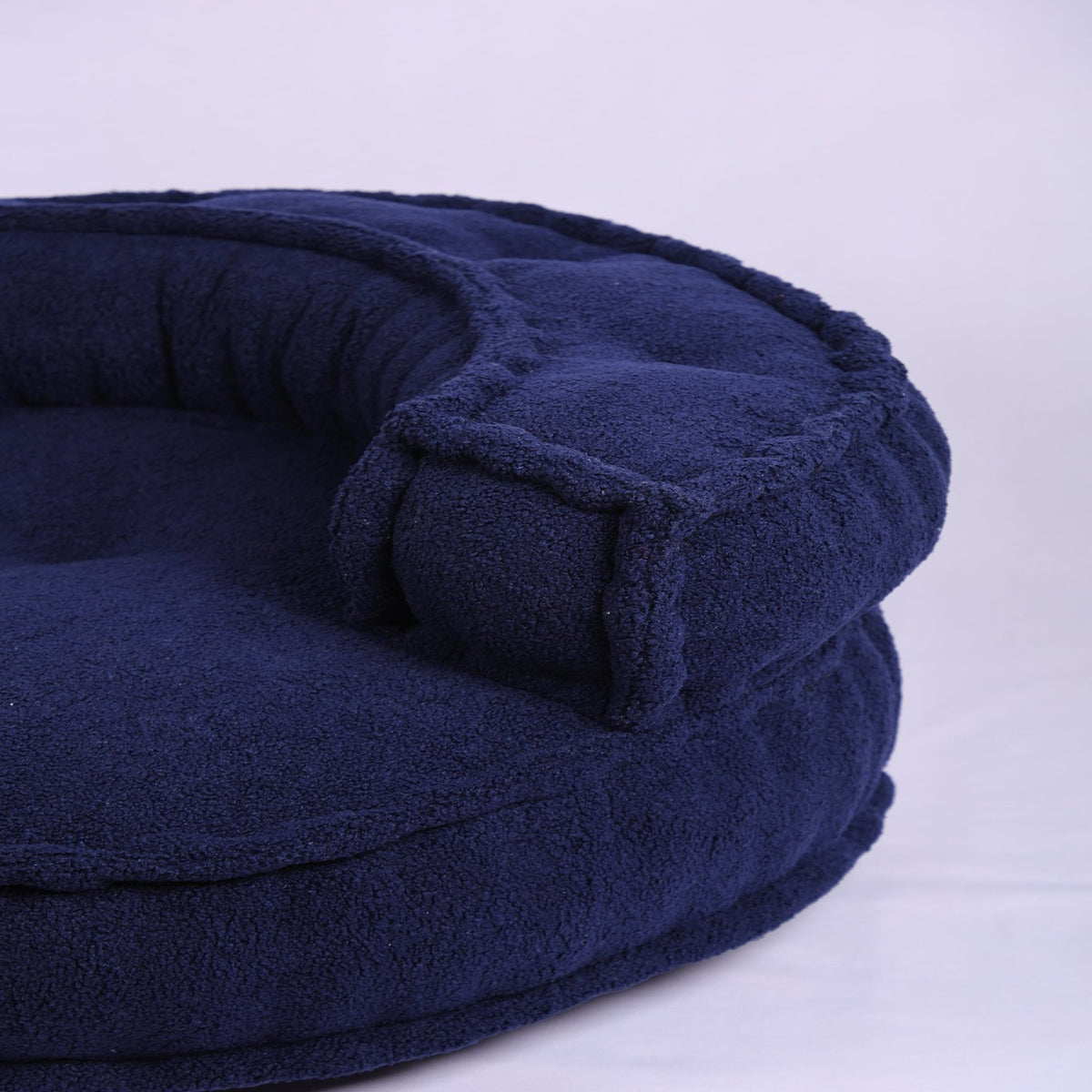 Blauwe Boucle vloerfauteuil – moderne loungezit
