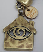 Sleutelhanger van leer Happy Home met Eye brons