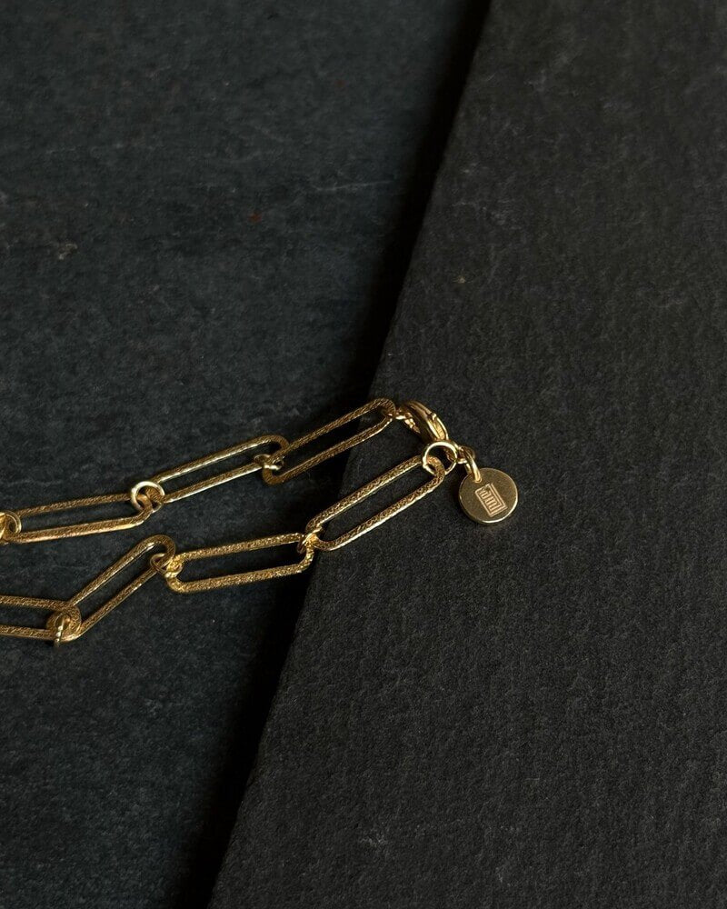 Schakelarmband met gouden munt