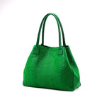 Lola – Italiaanse leren tas met python-reliëf – Groen