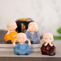 Set van Boeddhabeelden van vier wijze monniken – hars – set van 4
