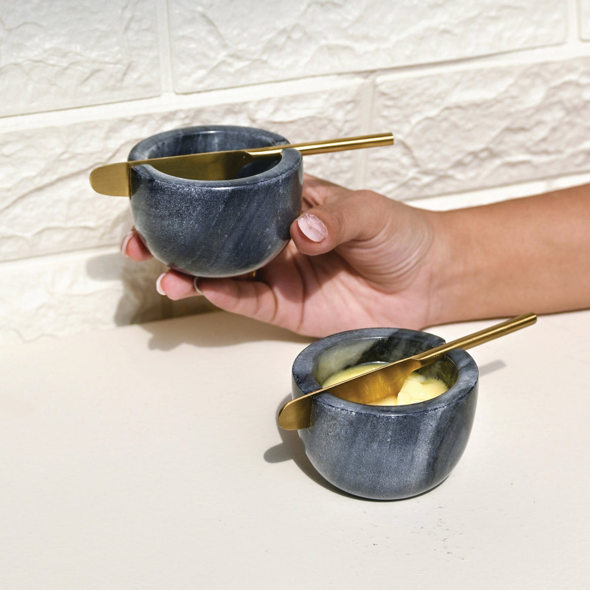 Marmeren botervloot met gouden mes