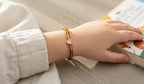 Kinderarmband natuursteen Amber 4 mm met hartje (14 cm)