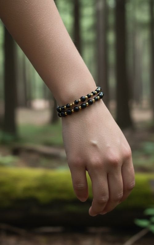 Dames armband Onyx 4 en 6 mm met RVS goudkleurige kralen